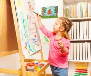 Little girl doing art-painting.