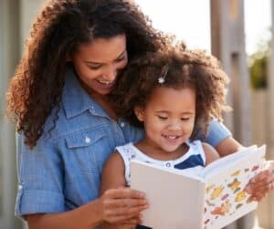 Mother and daughter reading together.