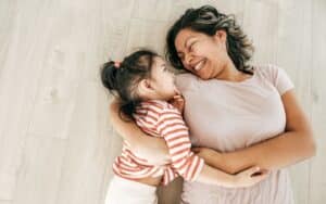 Mother playing with child who has delayed milestones.