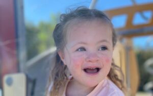 Little girl learning vocabulary at the playground.