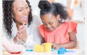 Pediatric Speech-Language Pathologist working with a little girl.