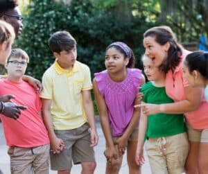 Coach explaining plan to a group of children.